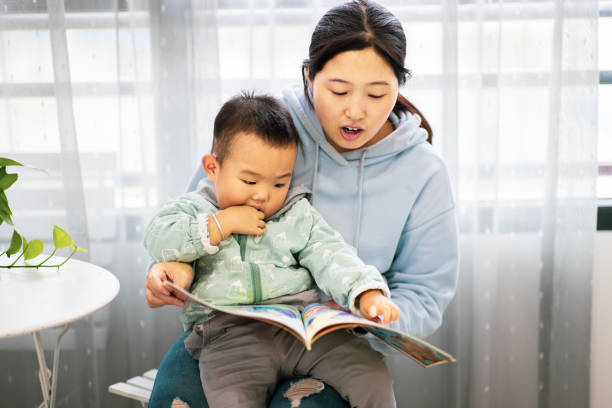 istock Mother with son reading a book together 1277090660