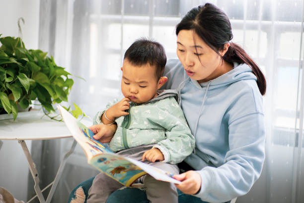 istock Mother with son reading a book together 1277090676