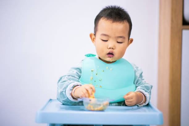 istock Asian baby boy study eating self 1277090690