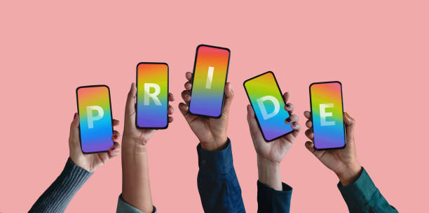 istock Freedom to Expression for LGTBQ Concept. Group of Diversity People showing Pride Text on Rainbow Color inside a Smartphone. Gender Online Campaign Issue via Social Media in Mobile Phone 1277092082