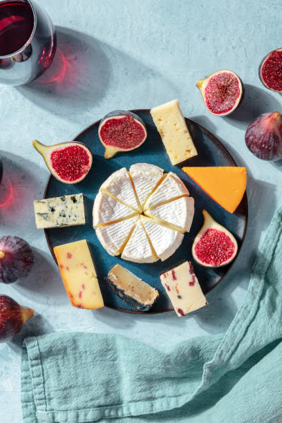 istock Cheese tasting. A selection of cheeses on a plate with figs, overhead shot 1277094143