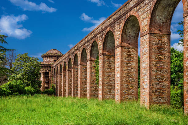 Lucca old aqueduct ruins Ancient architecture in Tuscany. The stone temple-cistern of Lucca old aqueduct ruins built in neoclassical style in 1823 lucca stock pictures, royalty-free photos & images