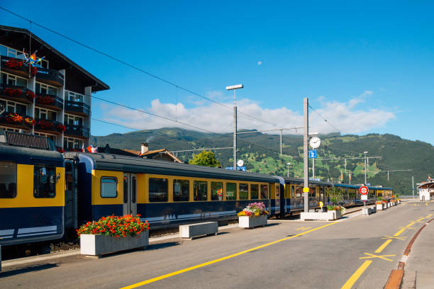 grindelwald train station with mountain in switzerland - interlaken railroad station train rural scene imagens e fotografias de stock