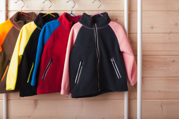 istock Colorful fleece jackets are hanging on hangers 1277100799
