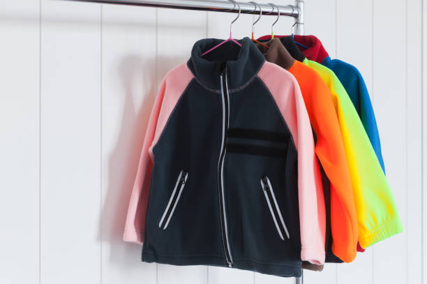 istock Colorful fleece jackets are hanging on hangers 1277100804