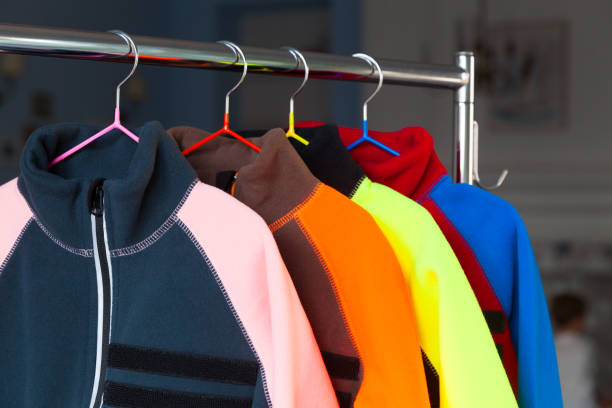istock Colorful fleece jackets are hanging on hangers 1277100808