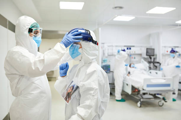 istock Doctors in Protective Workwear During Pandemic 1277102565