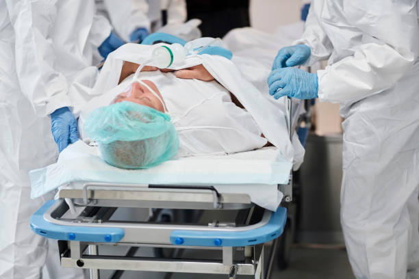 istock Doctor wheeling patient on gurney at hospital 1277102622