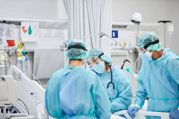 istock Doctors and Nurses in Operating Room During Pandemic 1277102664