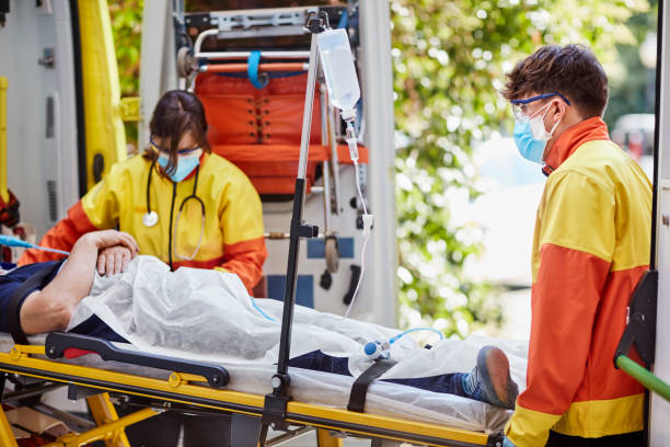 istock Paramedics Carrying Patient on Stretcher 1277102783