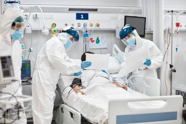 istock Healthcare Workers Examining Patient in Hospital 1277102792