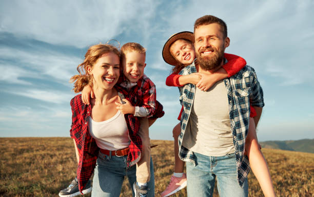 istock Happy family: mother, father, children son and daughter playing 1277102816