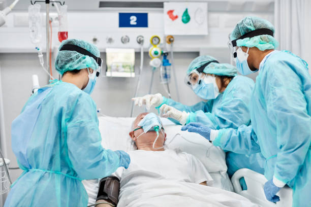 istock Medical Professionals Operating Patient in Ward During COVID-19 1277102896