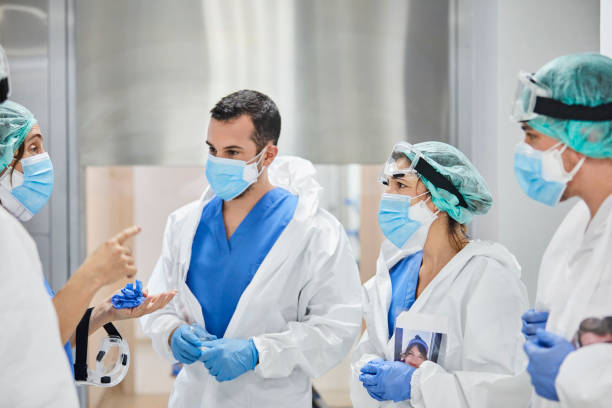 istock Healthcare Workers Discussing During COVID-19 1277102947