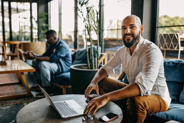 istock Two freelancers working in a coffee bar during corona virus 1277103086