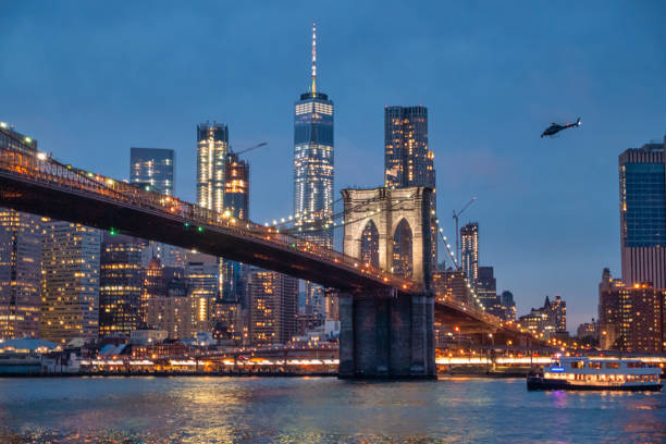 View of Brooklyn Bridge and Lower Manhattan at twilight. New York City. USA