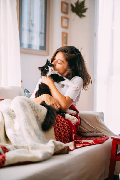 istock Woman Resting on the Sofa With Her Cat 1277104300