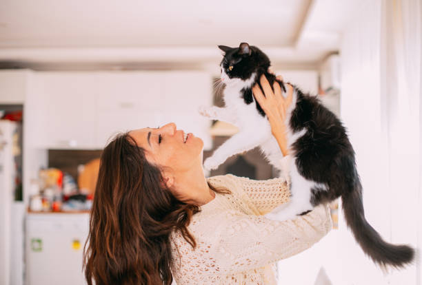 istock Cute Urban Woman Hugging Her Cat 1277104820
