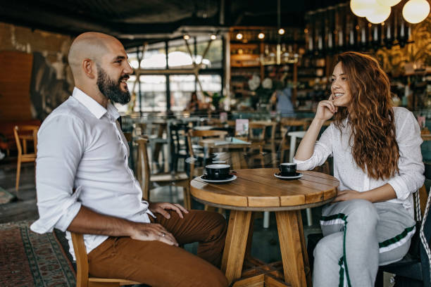 istock Two friends drinking coffee in the coffee shop 1277104854