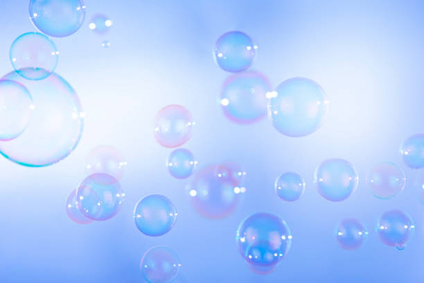 Colorful soap bubbles float natural background. Soap bar background