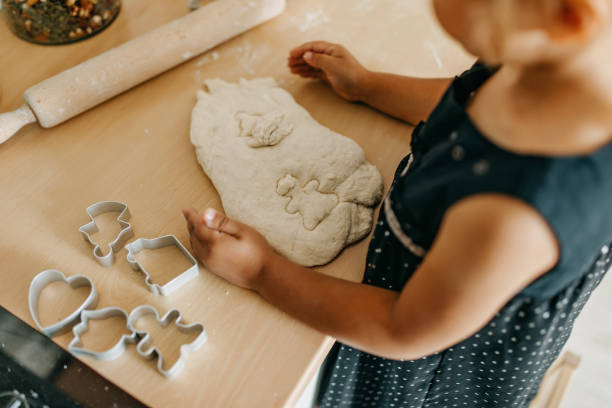 istock Little girl playing with dough 1277106051