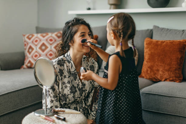 istock Daughter puts make up on mother 1277106190