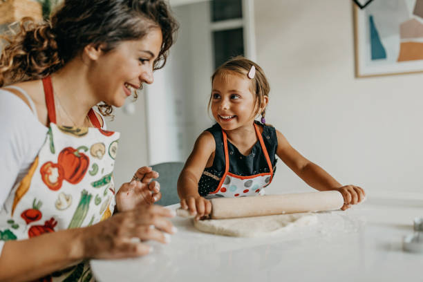 istock Mother and daughter make cookies 1277106226