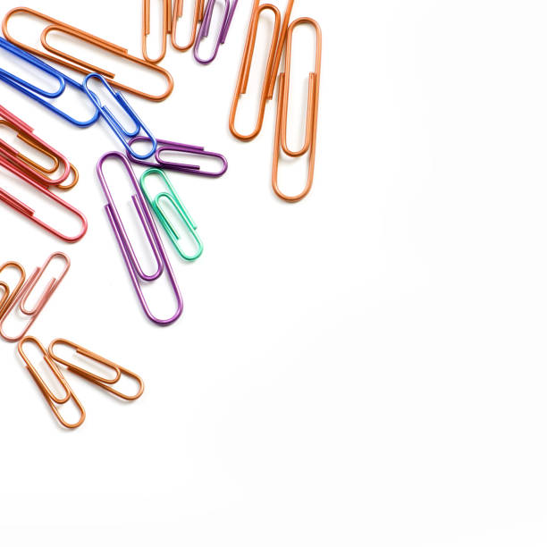 istock Paper clips on a white background. Stationery. Background 1277106262