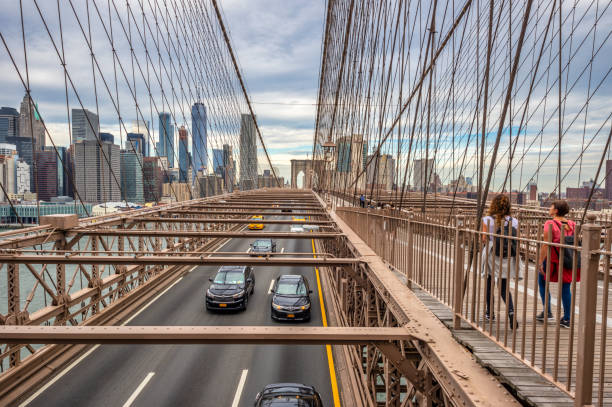 New York City, USA - October 11, 2017: busy Brooklyn Bridge with The One World Trade Center in the background