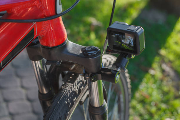 istock Action camera with a screen on, mounted next to a mountain bike wheel 1277106469