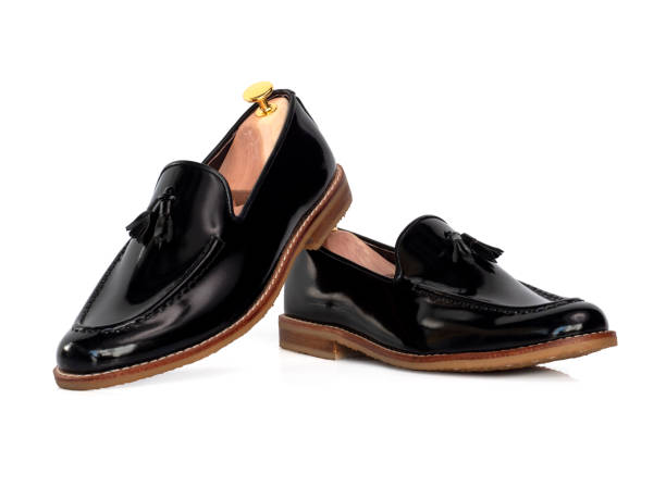 istock Men fashion leather black shoe with shoe tree (shape supporter) isolate on white background. 1277108909