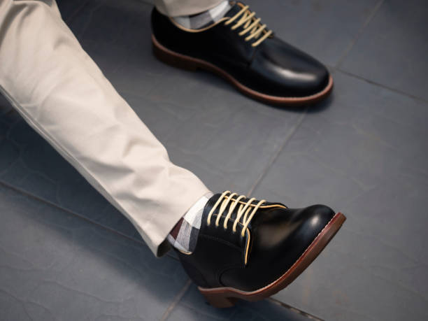 Men fashion with trousers and black shoes leather. Men fashion with trousers and black shoes leather. dress shoe stock pictures, royalty-free photos & images