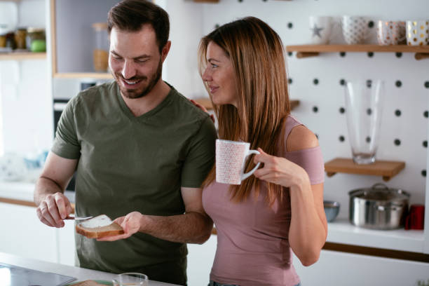 istock Young couple making breakfast at home. 1277108974