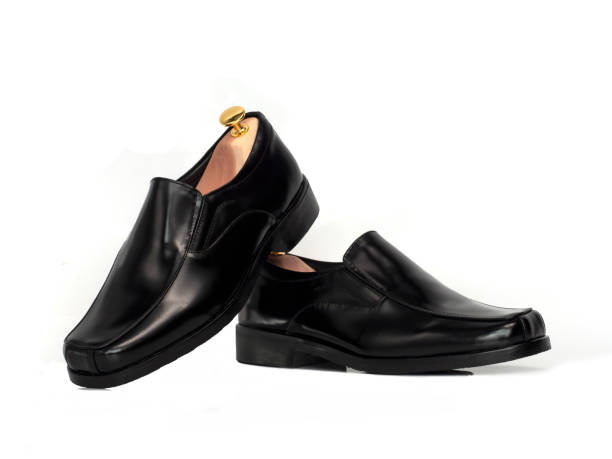 istock Men fashion leather loafer black shoe with shoe tree (shape supporter) isolate on white background. 1277109026