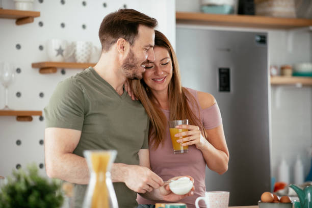 istock Young couple making breakfast at home. 1277109140