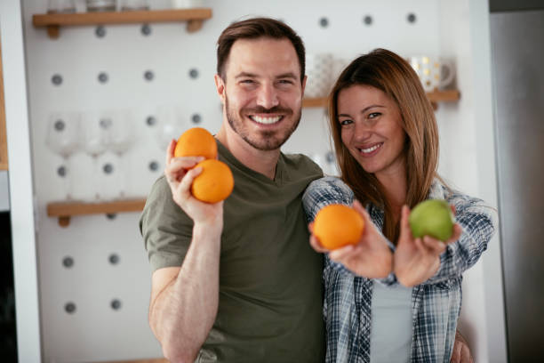 istock Young couple making breakfast at home. 1277109228
