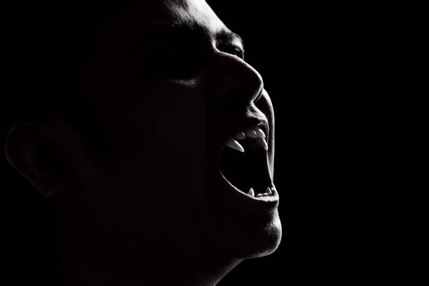 Scary vampire man on dark background Scary vampire man on dark background vampire stock pictures, royalty-free photos & images