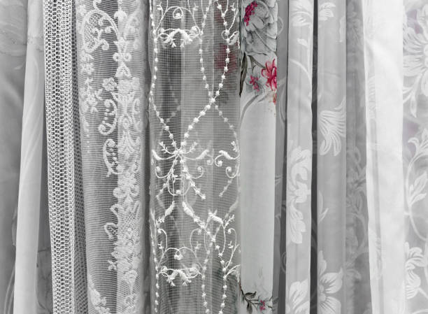 istock Samples of tulle fabrics. Background and texture of tulle for windows. 1277109879
