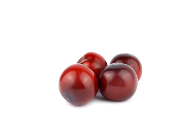 Sweet delicious plums isolated on white background