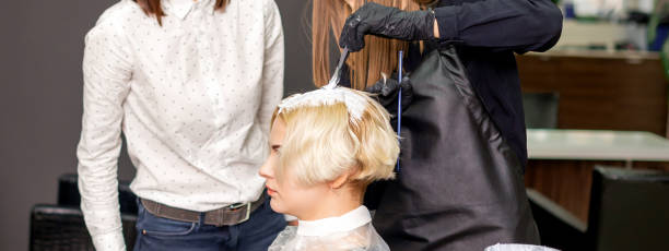 istock Trainee learns to draw women's hair 1277110682