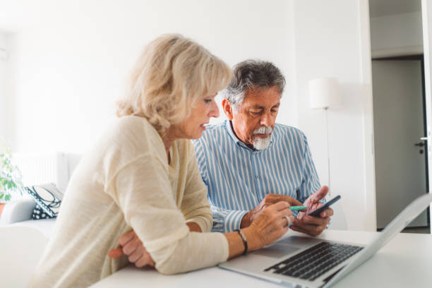 istock Elderly couple calculating their monthy expenses 1277112336
