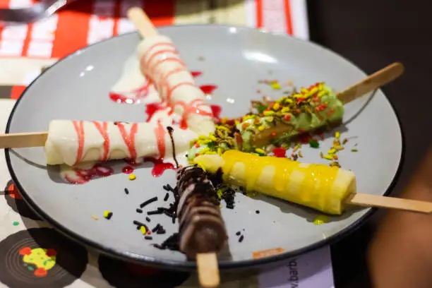 Photo of different flavored kulfi icecream served on platter.