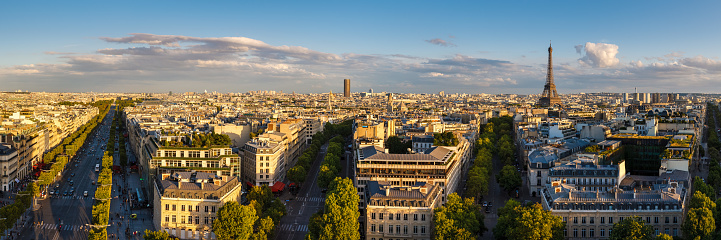Paris, 75004, FRANCE - August 18, 2014: Panoramic view of rooftops and Avenues of Paris at sunset in summer. From left to right: Champs Elysées, Avenue Marceau and Avenue Iéna