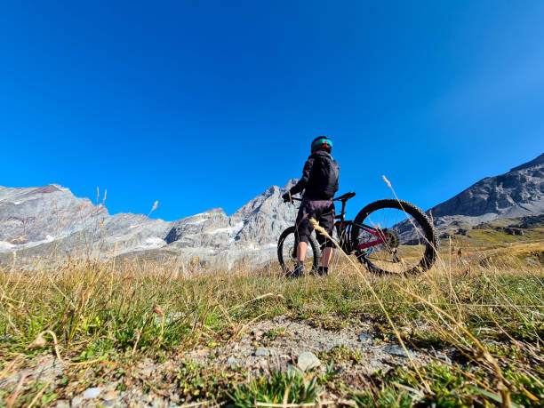 istock Mountain Biking in the Alps under Matterhorn 1277114891