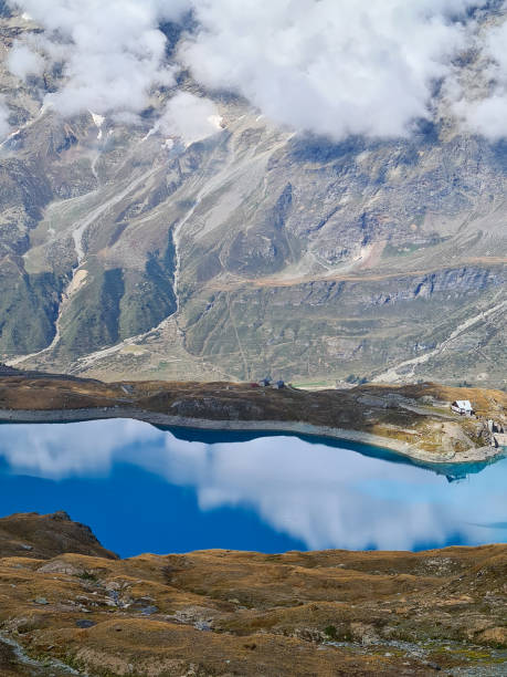 istock Beautiful lake Lago Goillet in Alps under Matterhorn 1277115145