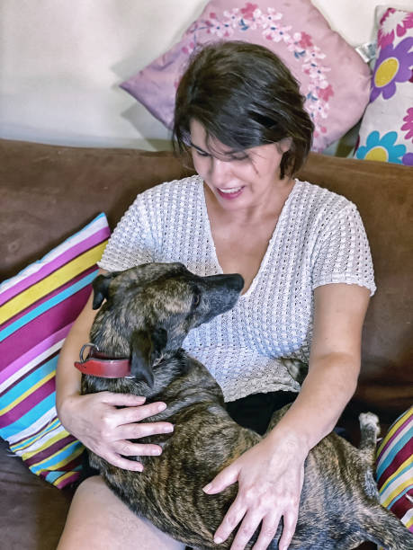 istock Beautiful woman with her pet. 1277115886