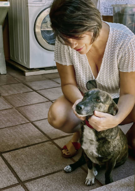istock Beautiful woman with her pet. 1277115918