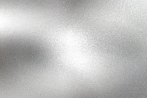 istock Glowing silver foil paper wall with copy space, abstract texture background 1277116057