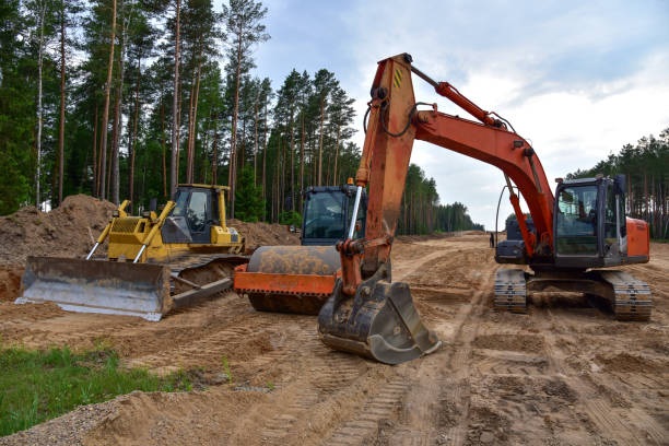 istock Bulldozer, Excavator and Soil compactor on road work. 1277116250