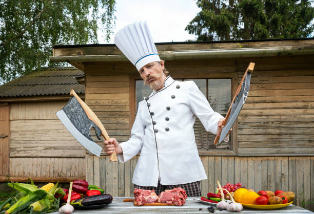 Cook is preparing an outdoor barbecue stock photo